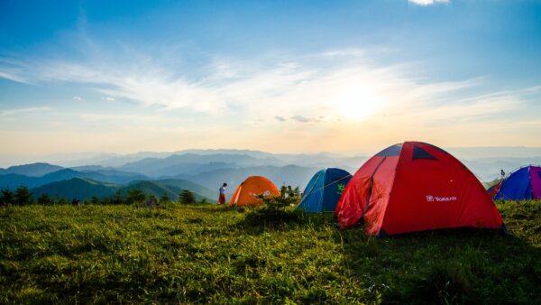 Pitched Dome Tents Overlooking Mountain Ranges